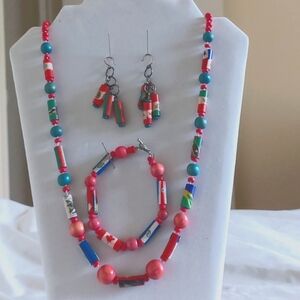 Matching beaded jewelry set including necklace, bracelet, and earrings